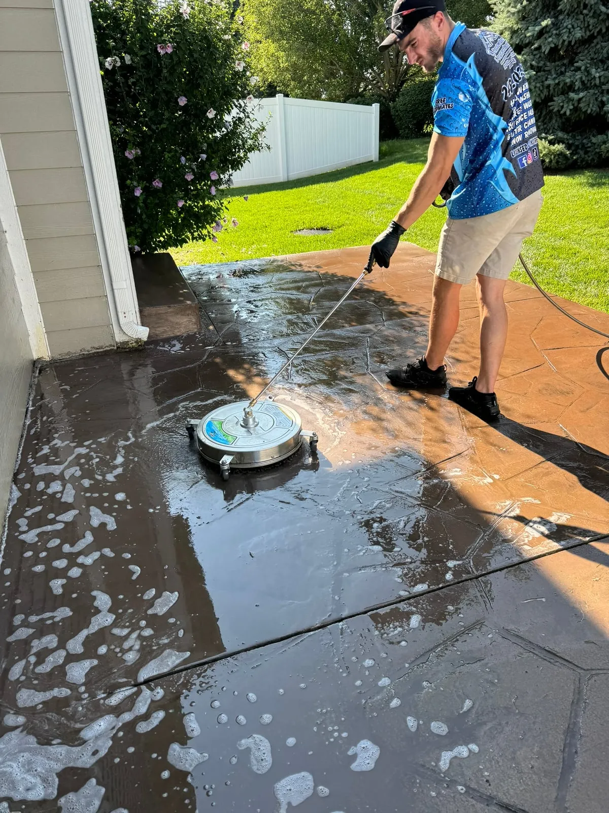 Surface cleaner in action on a concrete patio